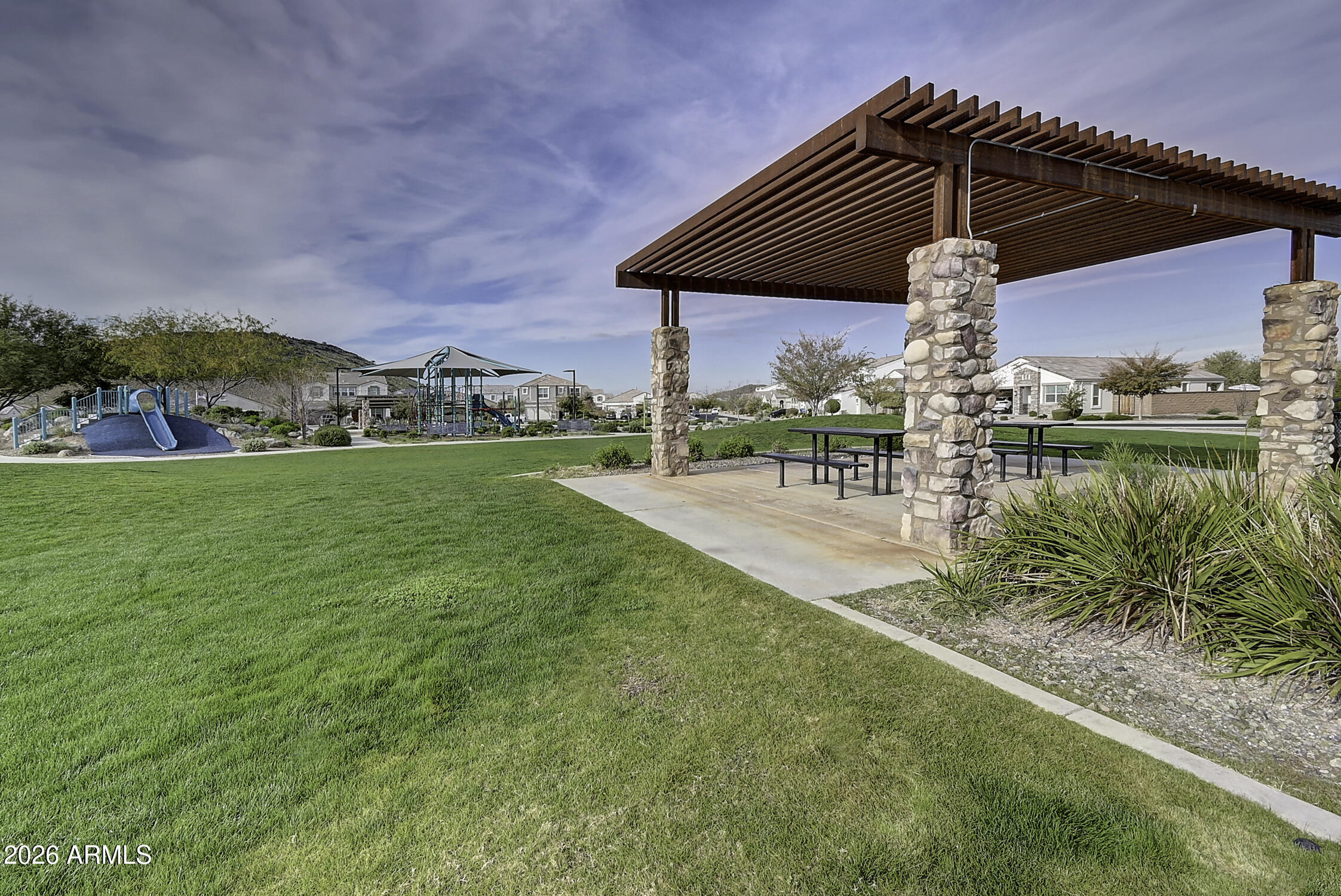 2140 East Alameda Road Phoenix, AZ 85024 - Photo 53 of 54 a view of a patio with a table and chairs under an umbrella