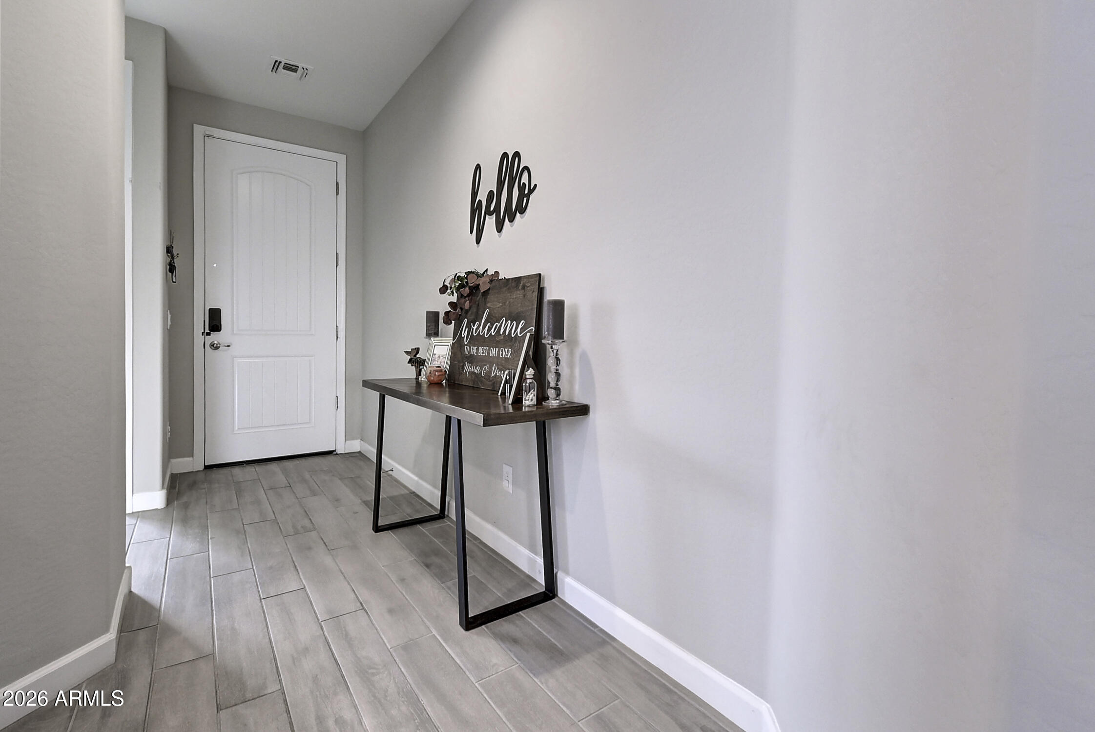 2140 East Alameda Road Phoenix, AZ 85024 - Photo 6 of 54 a view of a hallway with wooden floor and entryway
