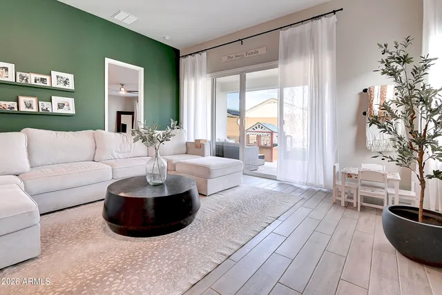 a living room with furniture and a large window