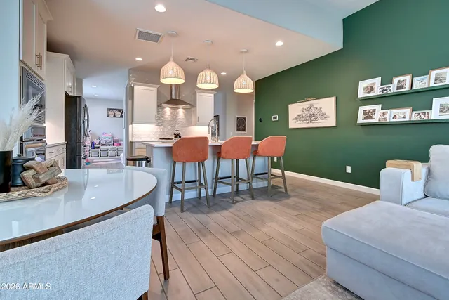 a living room with furniture a rug and a large window