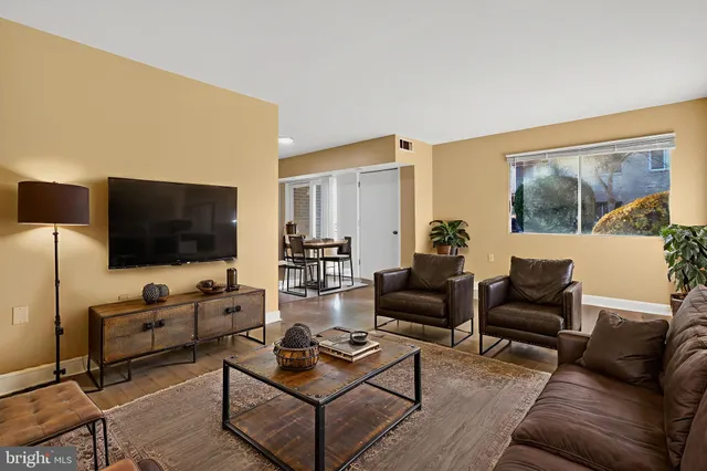 a kitchen with stainless steel appliances granite countertop a sink and dishwasher a stove top oven with wooden floor