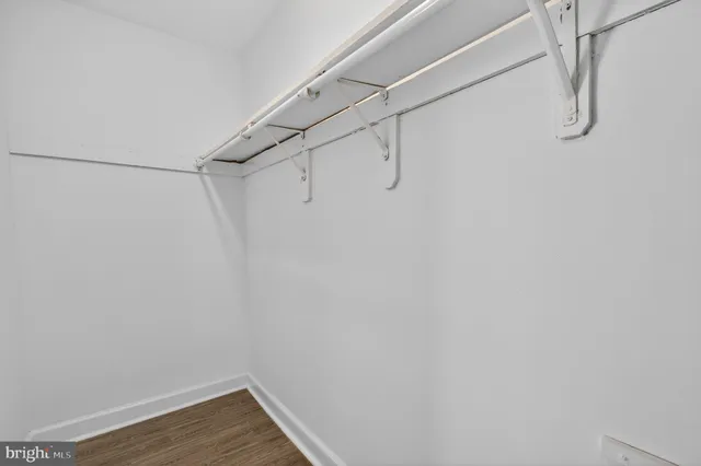 a bathroom with a sink toilet and mirror