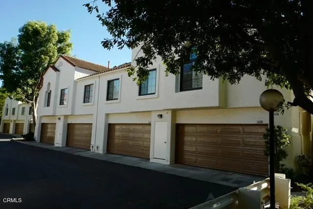 a front view of a house with yard
