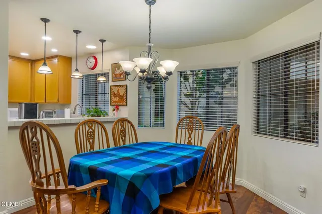 a dining room with furniture and window