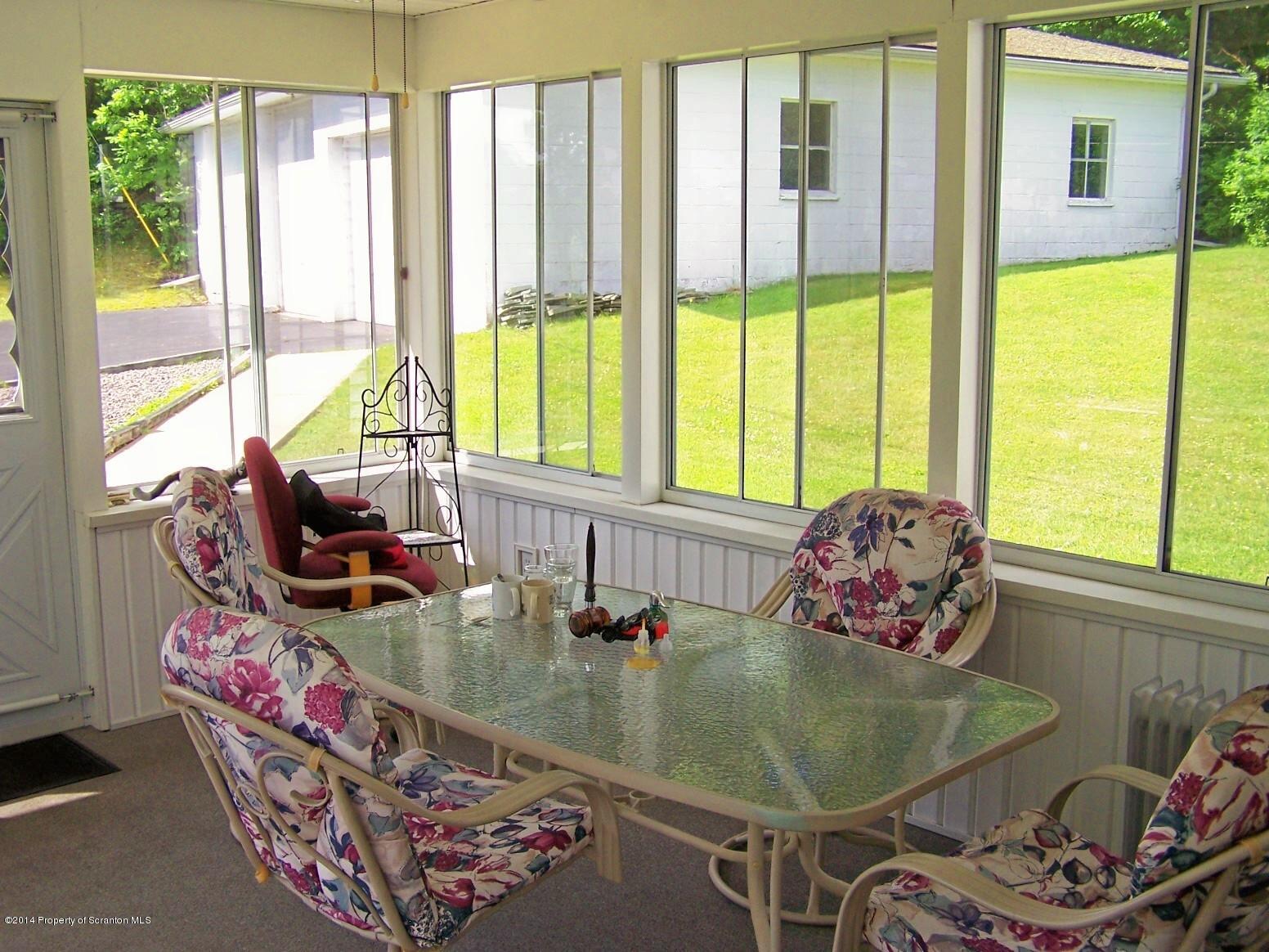 1327 Demunds Road Dallas, PA 18612 - Photo 29 of 39 a room with table chairs and windows