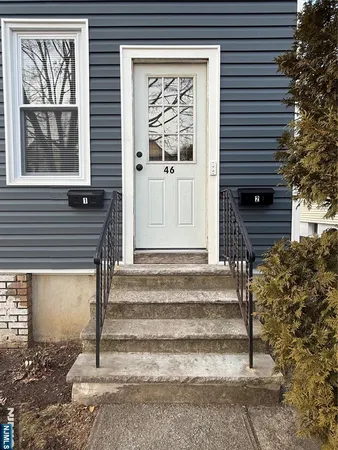a view of a entryway door front of a house