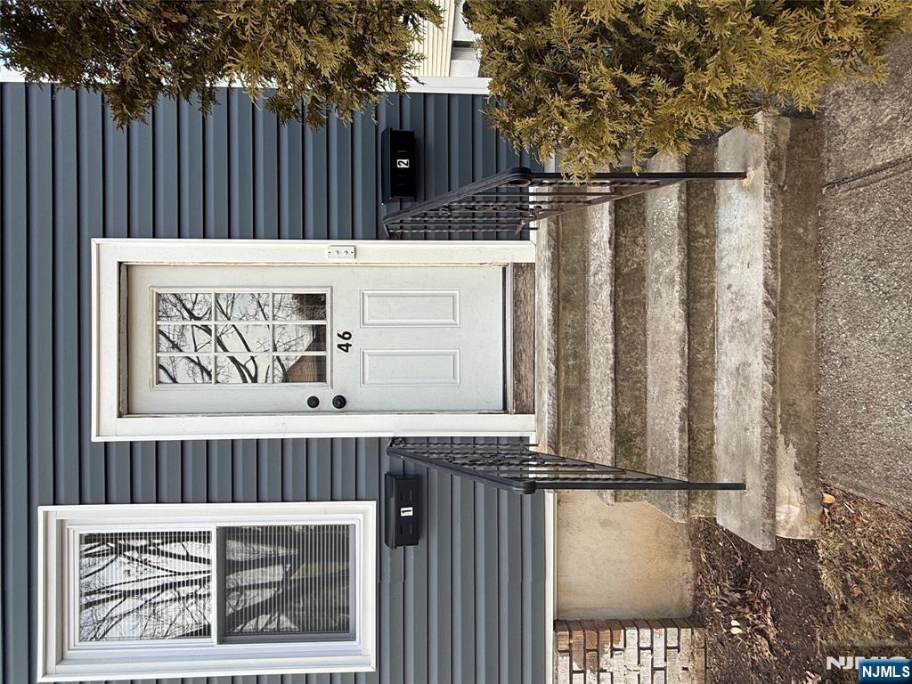 a view of a entryway door front of a house