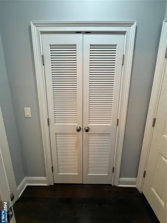 an empty room with wooden floor