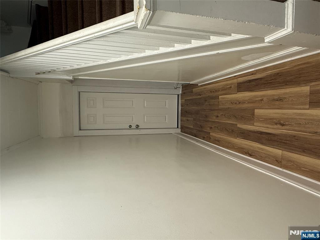 46 High Street Clifton, NJ 07014 - Photo 2 of 14 a view of a hallway with wooden floor and stairs