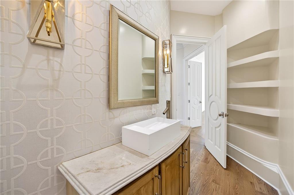 5320 Riverview Road Northwest Atlanta, GA 30339 - Photo 33 of 83 a bathroom with a sink a toilet and a mirror