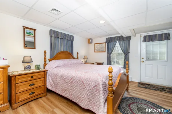 a bed room with a bed and a window