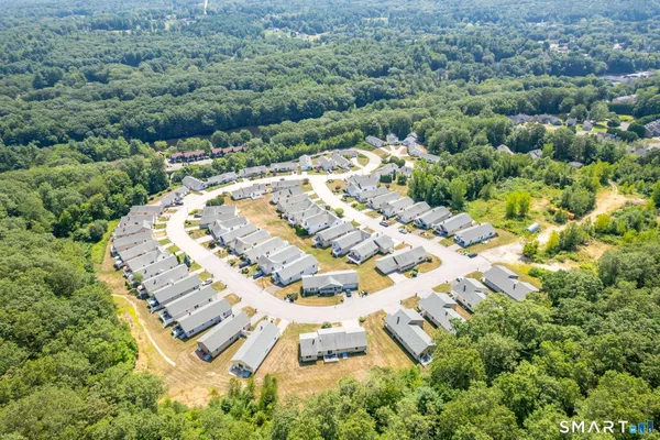 an aerial view of residential house with outdoor space
