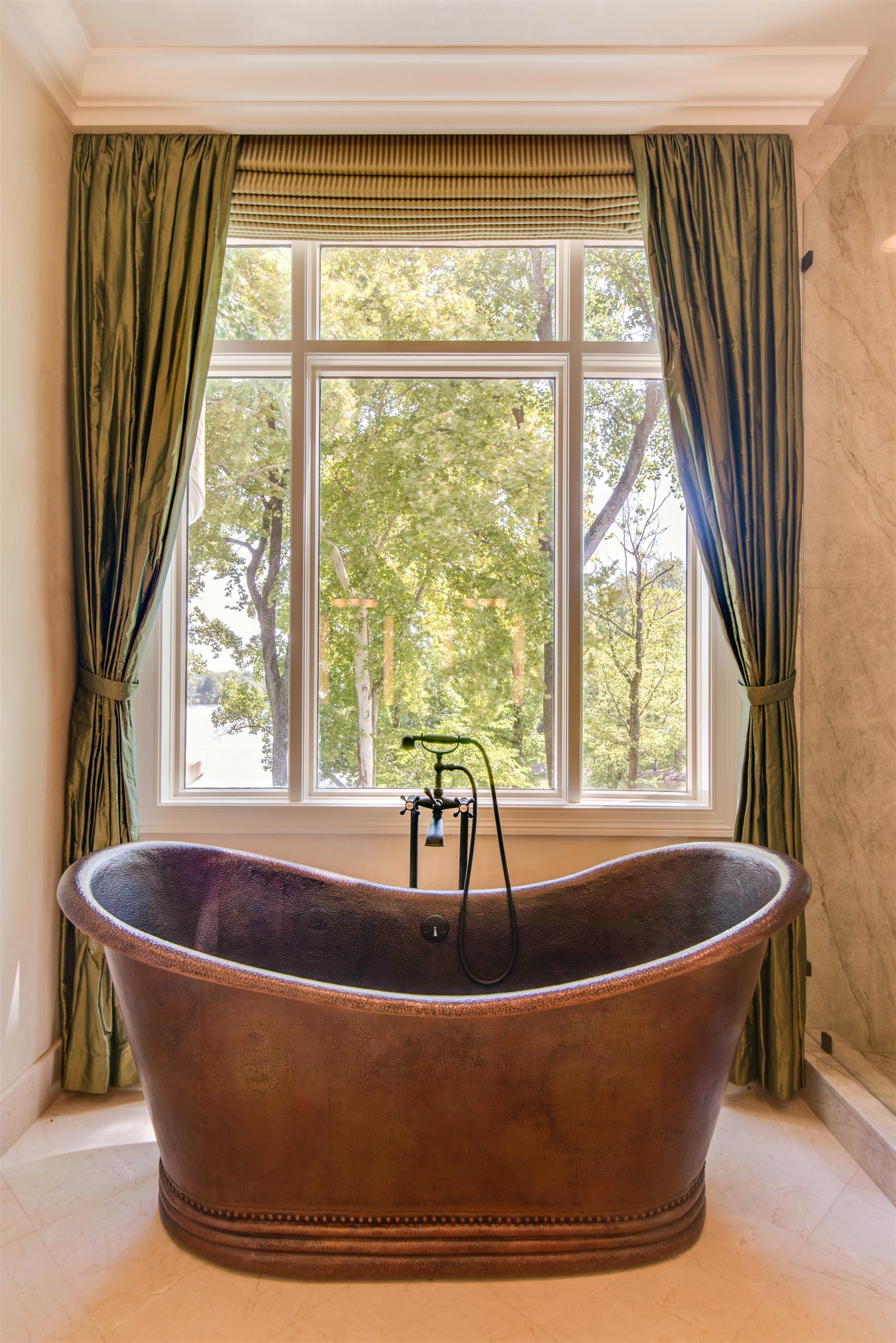 175 Cherokee Dock Road Lebanon, TN 37087 - Photo 17 of 30 a bath tub sitting in a bathroom next to a window