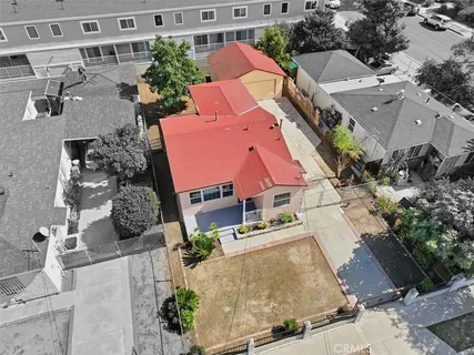 an aerial view of residential houses with outdoor space