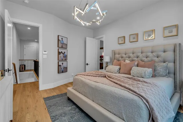 a bathroom with a tub sink mirror and vanity
