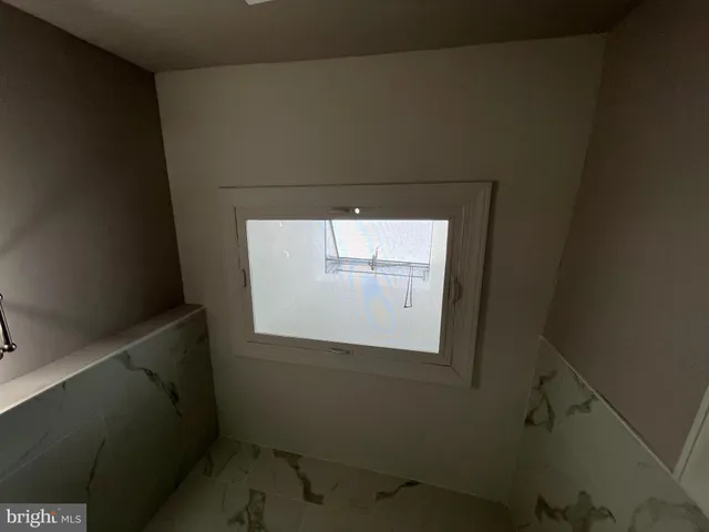 a utility room with window washer and dryer