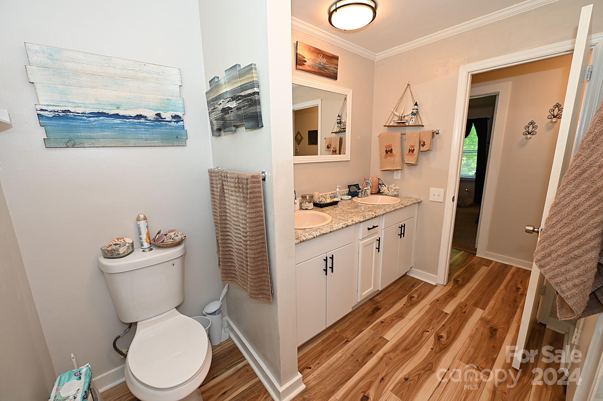 110 Sunny Lane Cherryville, NC 28021 - Photo 18 of 26 a white toilet sitting next to a bathroom sink