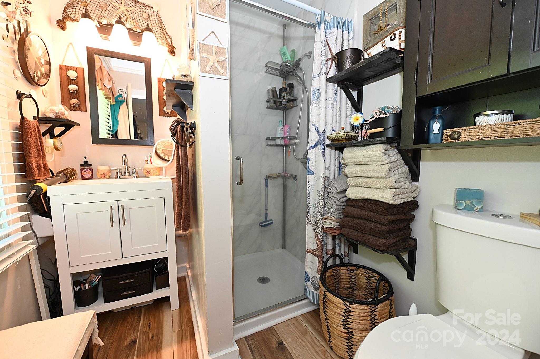 110 Sunny Lane Cherryville, NC 28021 - Photo 21 of 26 a bathroom with a toilet a sink and a bathtub