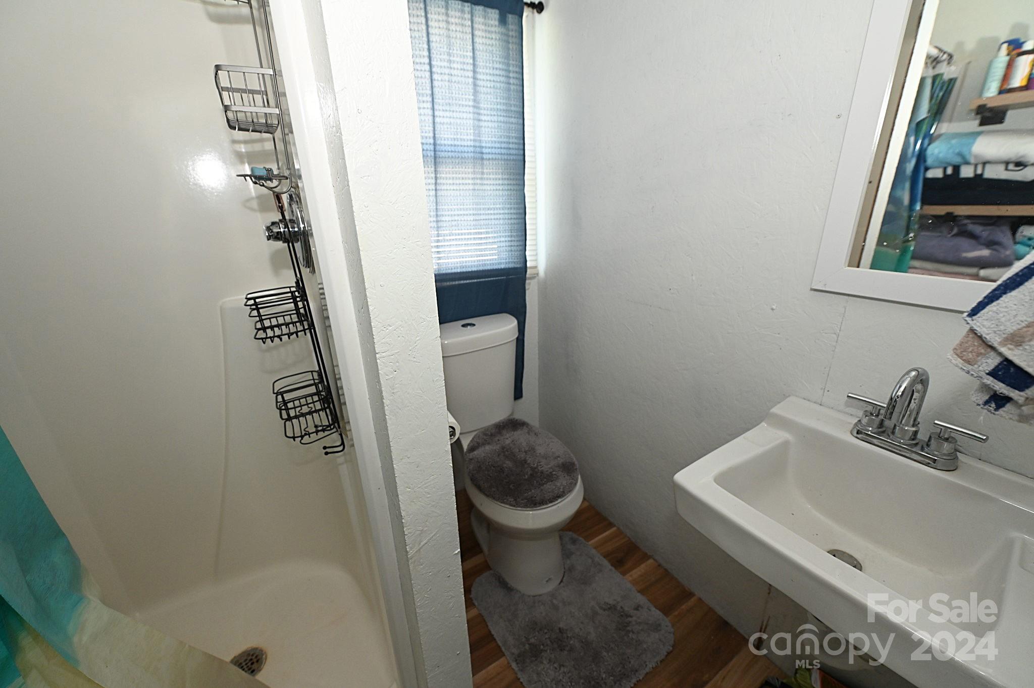 110 Sunny Lane Cherryville, NC 28021 - Photo 25 of 26 a bathroom with a sink a toilet and shower