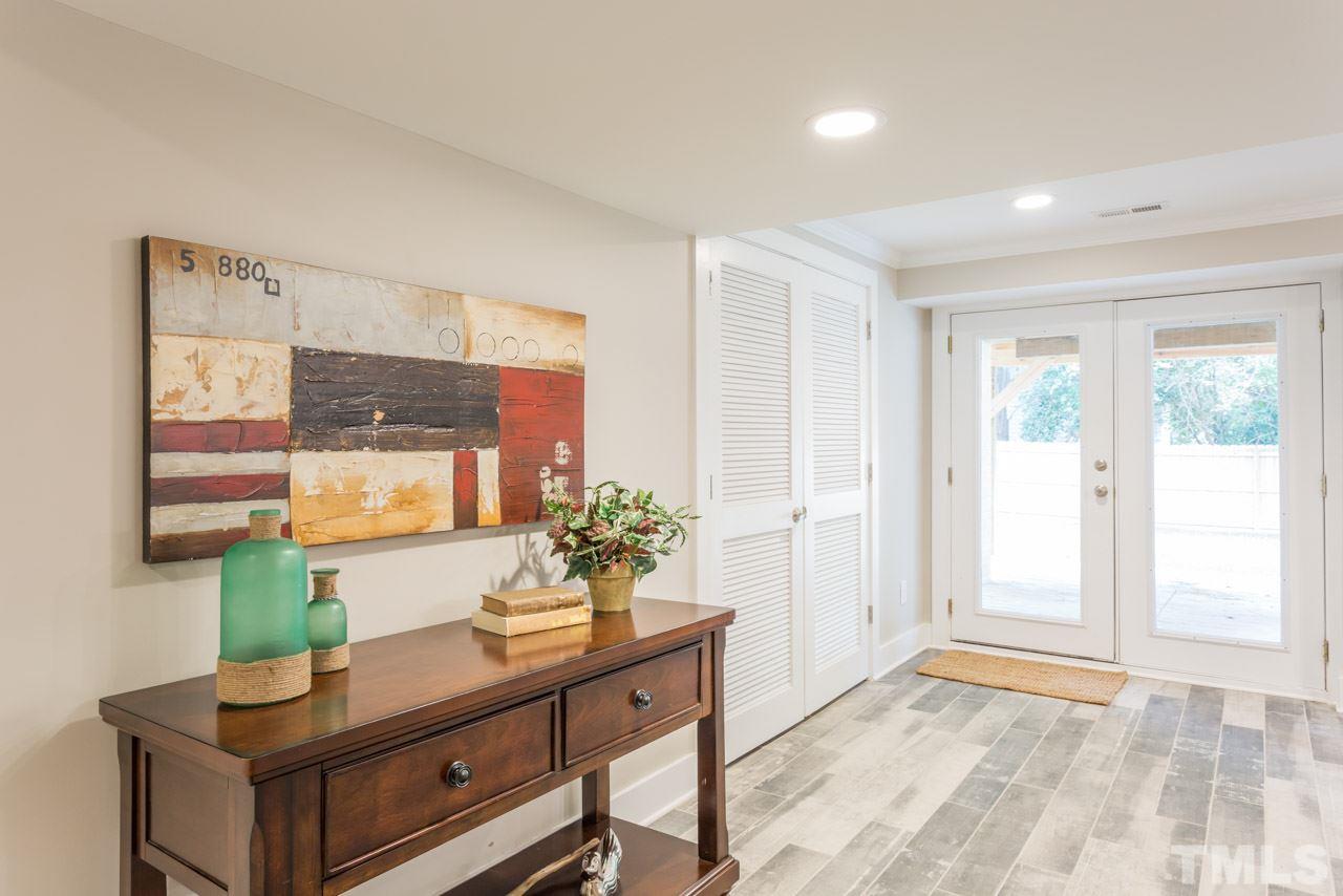 3705 Edwards Mill Road Raleigh, NC 27612 - Photo 19 of 25 a living room with furniture and a potted plant