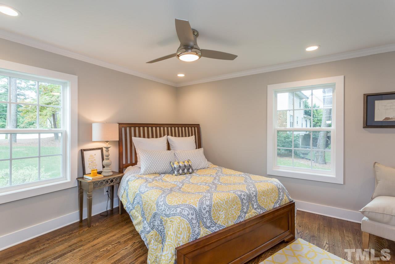 3705 Edwards Mill Road Raleigh, NC 27612 - Photo 8 of 25 a bedroom with a bed and a window