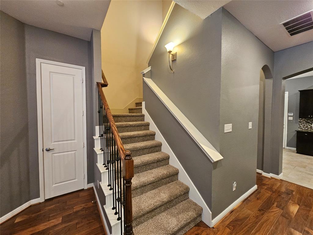 8627 Calvin Road Irving, TX 75063 - Photo 15 of 33 a view of entryway with wooden floor and stairs