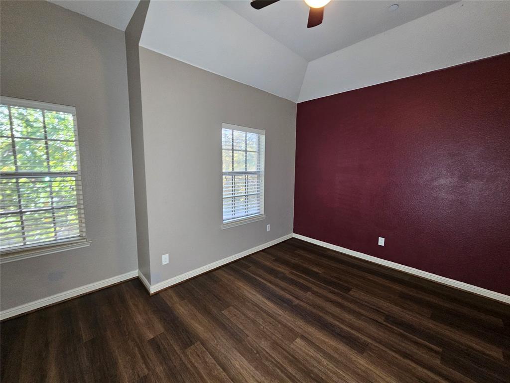 8627 Calvin Road Irving, TX 75063 - Photo 19 of 33 wooden floor in an empty room with a window