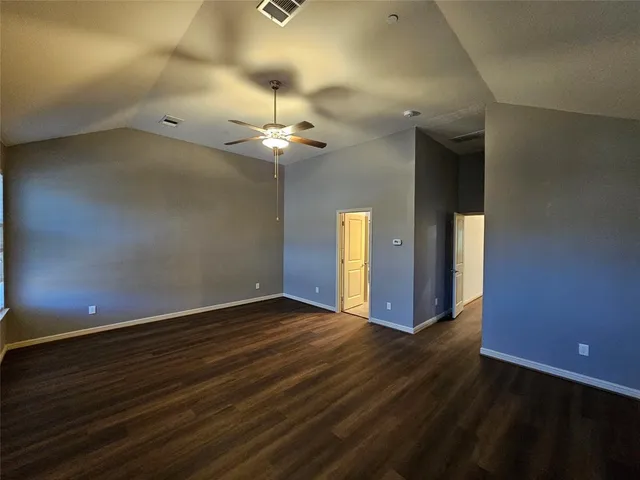 a bathroom with a shower and toilet