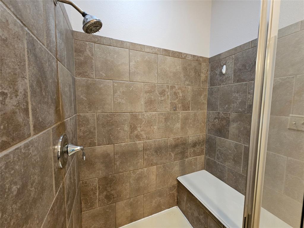 8627 Calvin Road Irving, TX 75063 - Photo 30 of 33 a bathroom with a shower