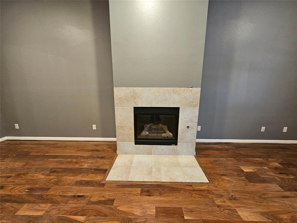 8627 Calvin Road Irving, TX 75063 - Photo 5 of 33 a view of a livingroom with a fireplace