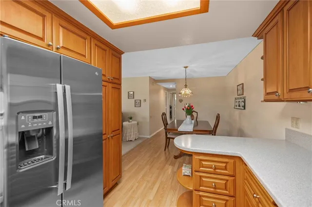 a kitchen with stainless steel appliances a refrigerator and a stove
