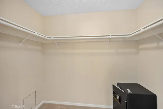 a view of an empty walk in closet