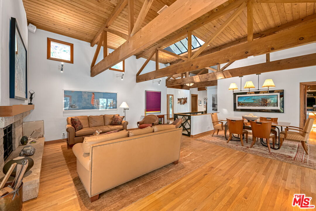 13360 Chalon Road Los Angeles, CA 90049 - Photo 13 of 69 a living room with furniture and a flat screen tv