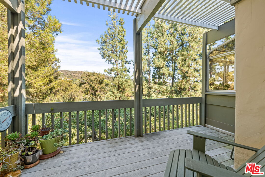 13360 Chalon Road Los Angeles, CA 90049 - Photo 26 of 69 a view of balcony with furniture