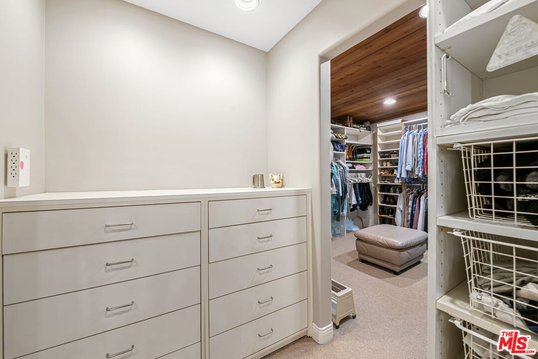 13360 Chalon Road Los Angeles, CA 90049 - Photo 44 of 69 a living room with furniture and walk in closet