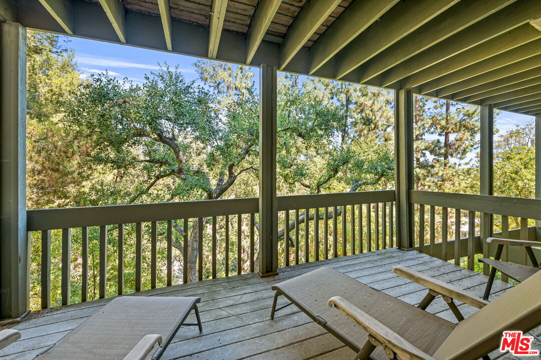 13360 Chalon Road Los Angeles, CA 90049 - Photo 45 of 69 a view of balcony with wooden floor