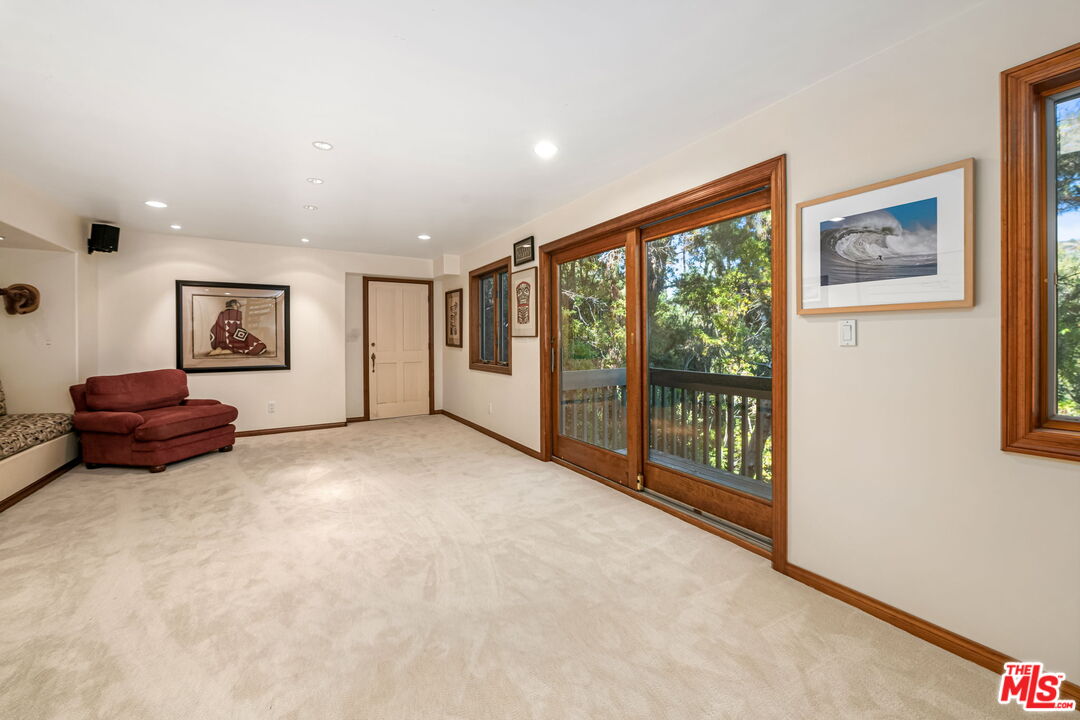 13360 Chalon Road Los Angeles, CA 90049 - Photo 46 of 69 a living room with furniture and a large window