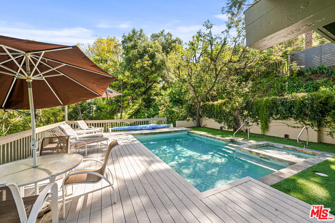 13360 Chalon Road Los Angeles, CA 90049 - Photo 57 of 69 a view of a backyard with sitting area