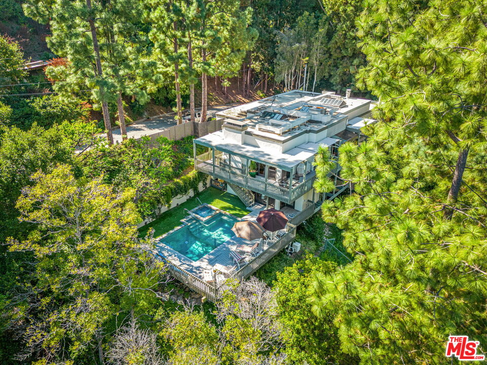 13360 Chalon Road Los Angeles, CA 90049 - Photo 60 of 69 a view of a backyard with chairs