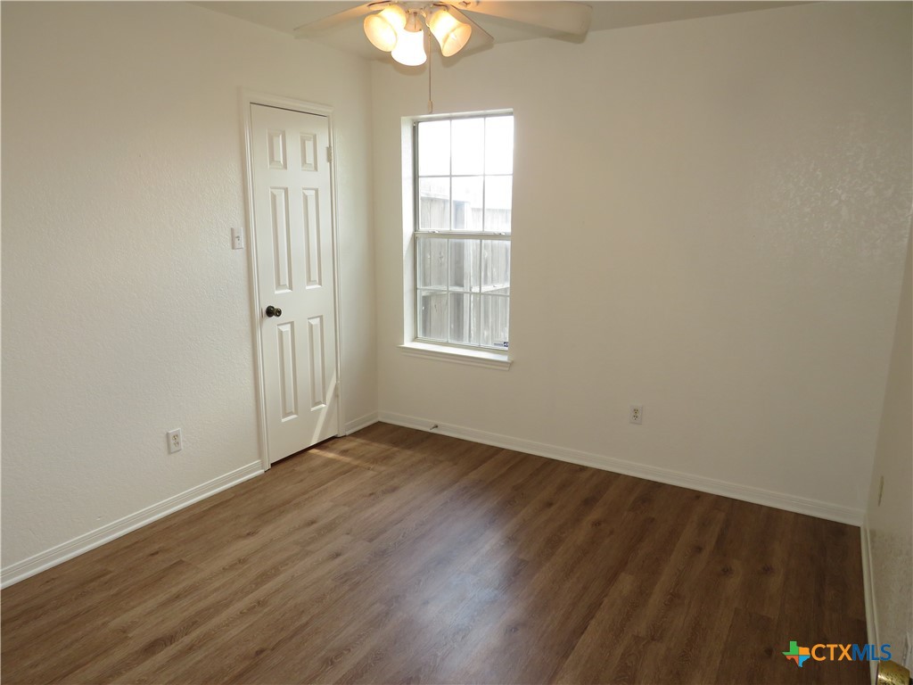 5009 James Loop Killeen, TX 76542 - Photo 15 of 24 an empty room with wooden floor and windows