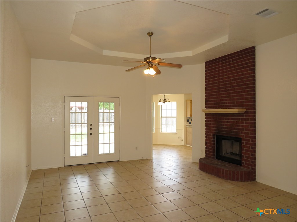 5009 James Loop Killeen, TX 76542 - Photo 2 of 24 a view of an empty room with a fireplace and a window