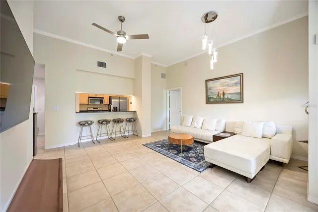 a living room with furniture and a rug