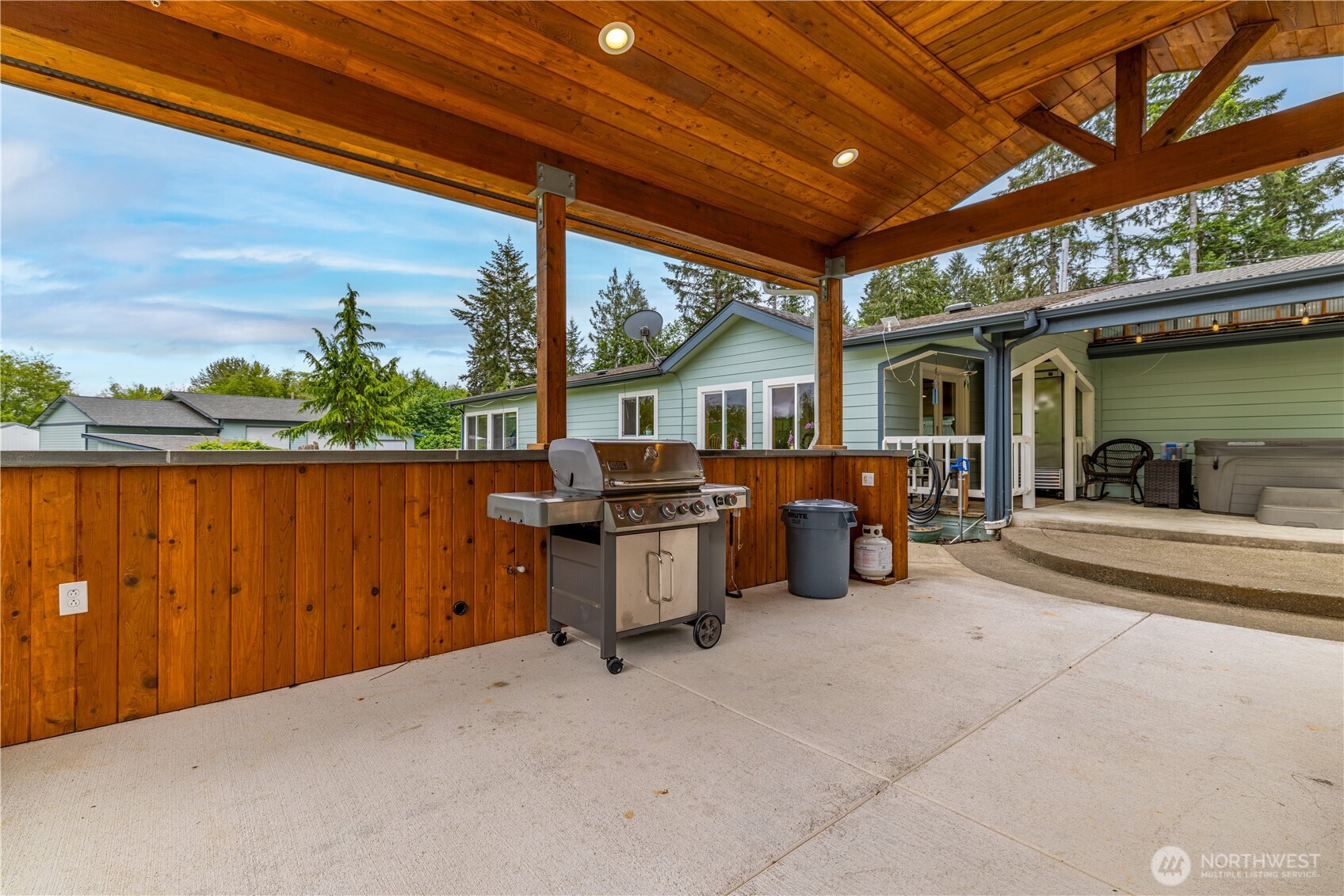741 Southeast Cook Plant Farm Road Shelton, WA 98584 - Photo 37 of 38 a view of a patio with table and chairs potted plants with wooden fence