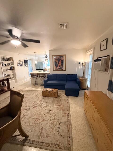 708 Bakers Lane Key West, FL 33040 - Photo 6 of 9 a living room with furniture and a refrigerator