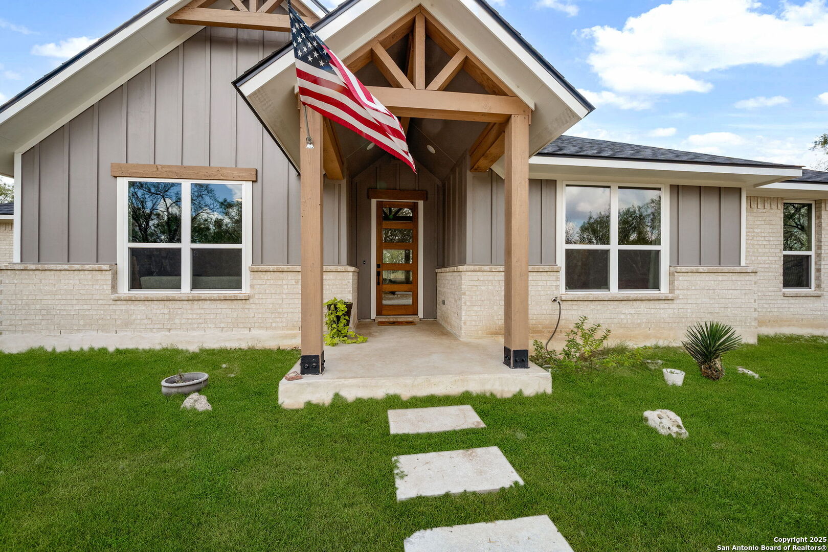 a front view of a house with garden