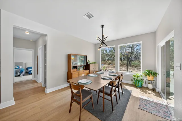 a view of a dining room with furniture window and wooden floor