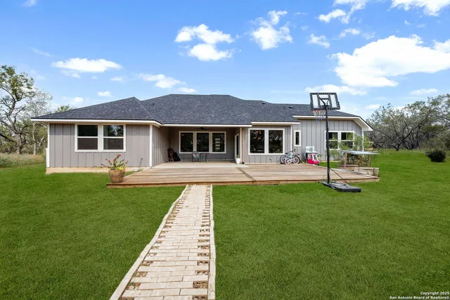 a front view of a house with a yard table and chairs