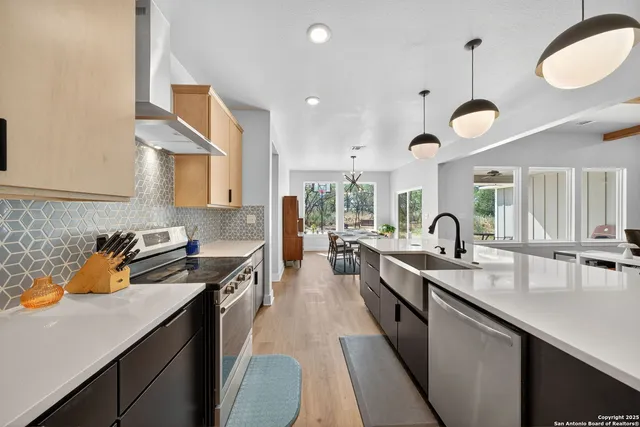 a kitchen with granite countertop counter space a sink stainless steel appliances and cabinets