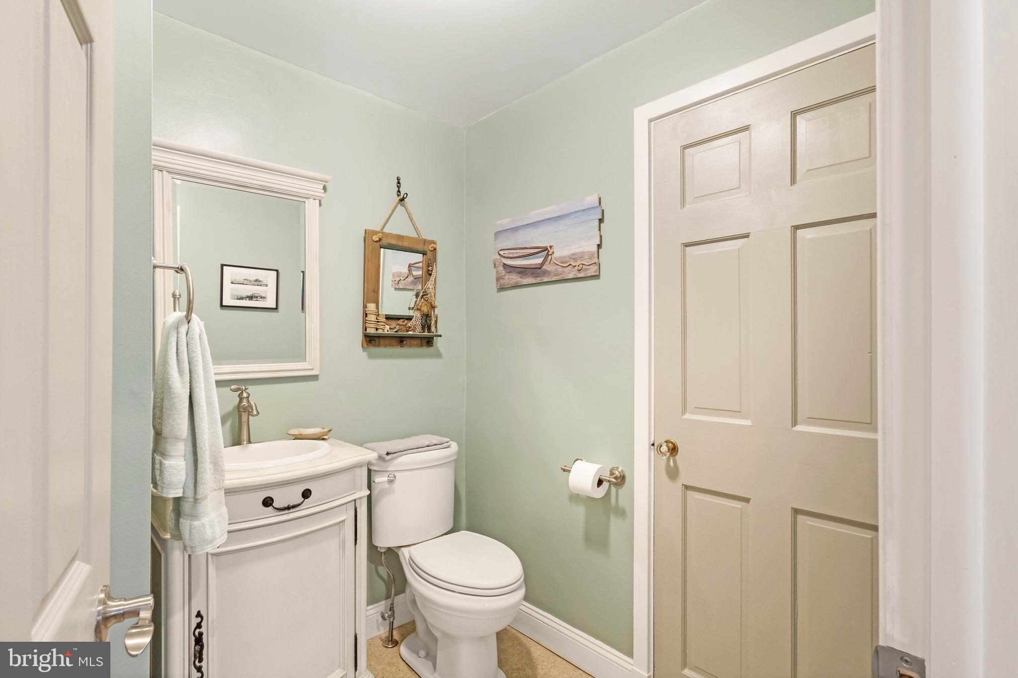 38 Read Street Seaford, DE 19973 - Photo 15 of 50 a bathroom with a sink toilet and vanity