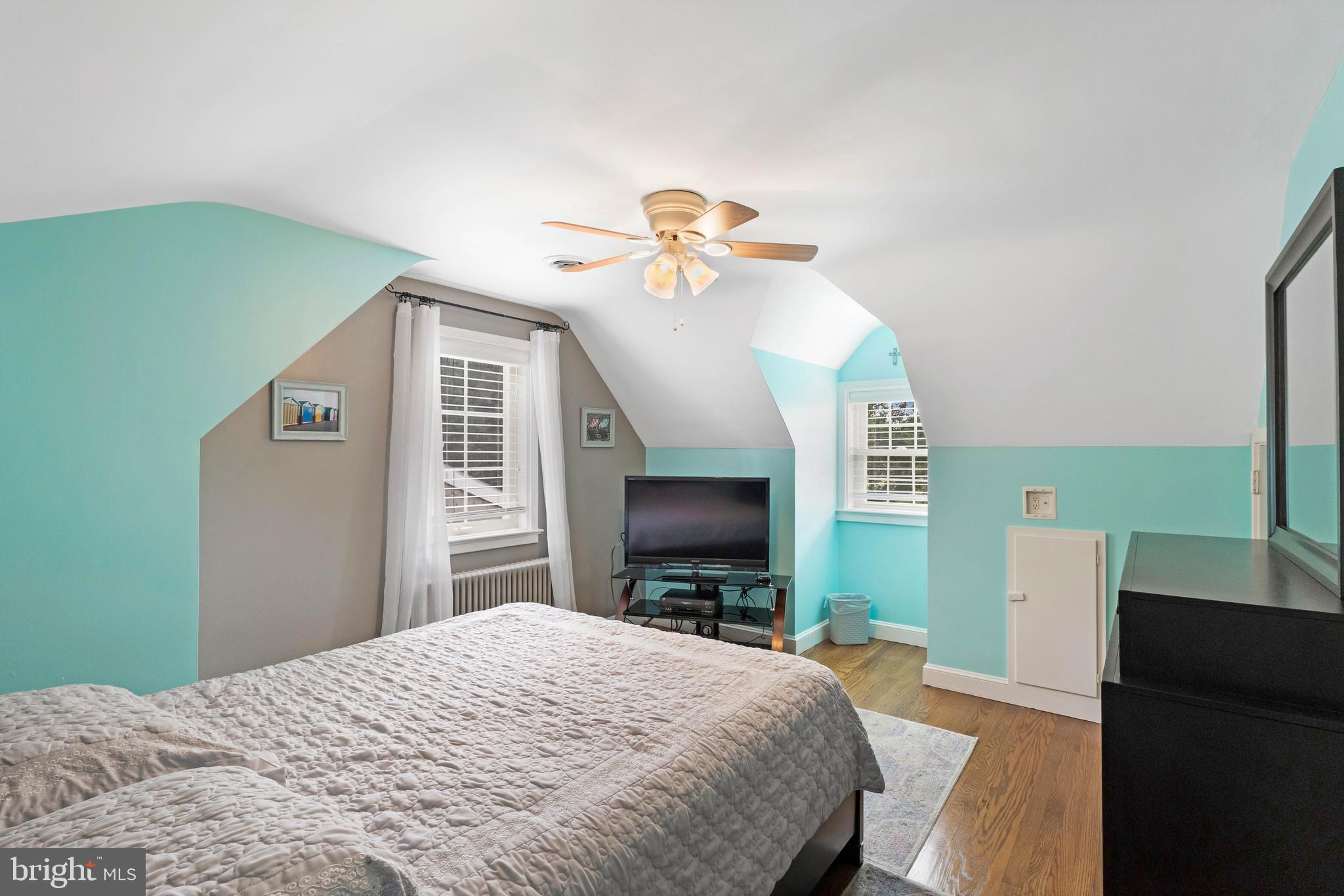 38 Read Street Seaford, DE 19973 - Photo 29 of 50 a bedroom with a bed and a chandelier